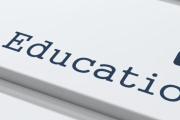 Decorative imagine of a keyboard with the word "education" on it